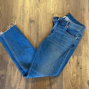 Medium wash jeans with distressed ankle